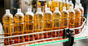 Plastic bottles moving down a right angle conveyor