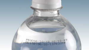 bottle of water with a date coding machine